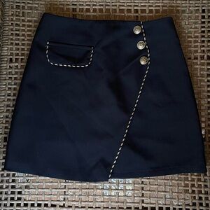 Black mini skirt with gold details